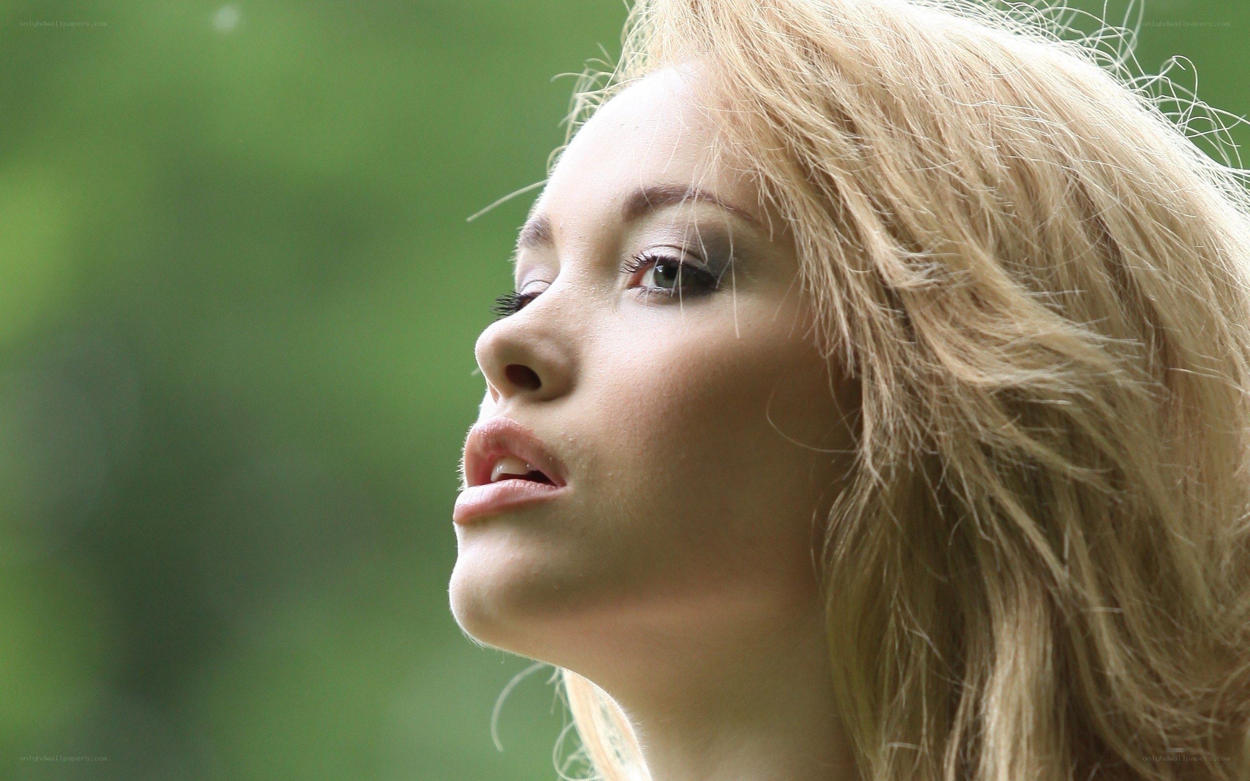 woman with blonde hair in profile