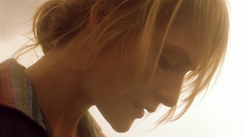 woman with blonde hair in profile