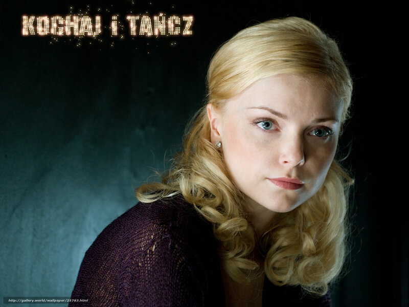 Woman with blonde hair in purple sweater