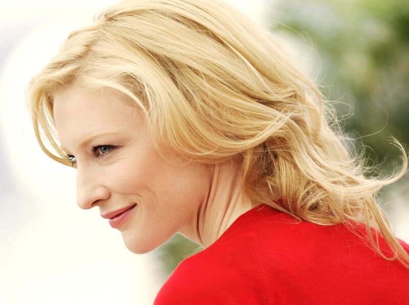 woman with blonde hair in red sweater