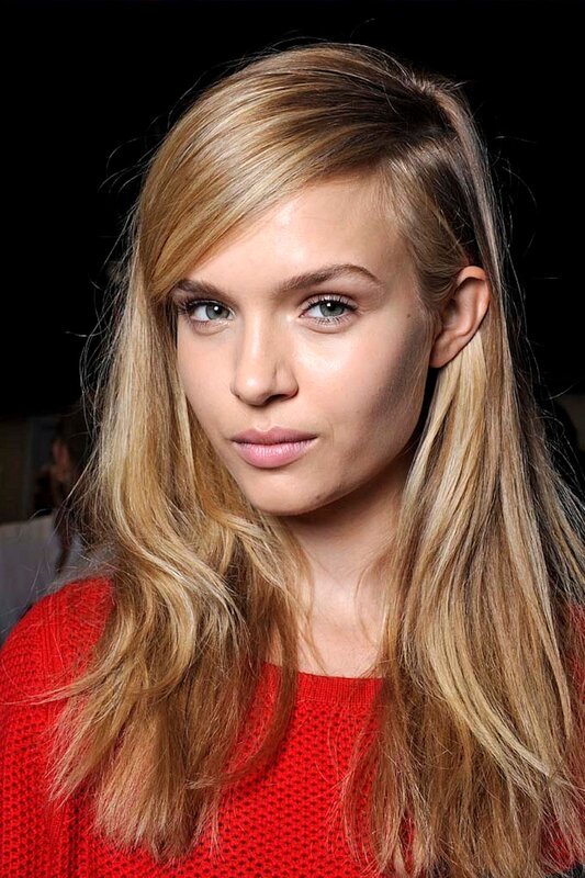 woman with blonde hair in red sweater