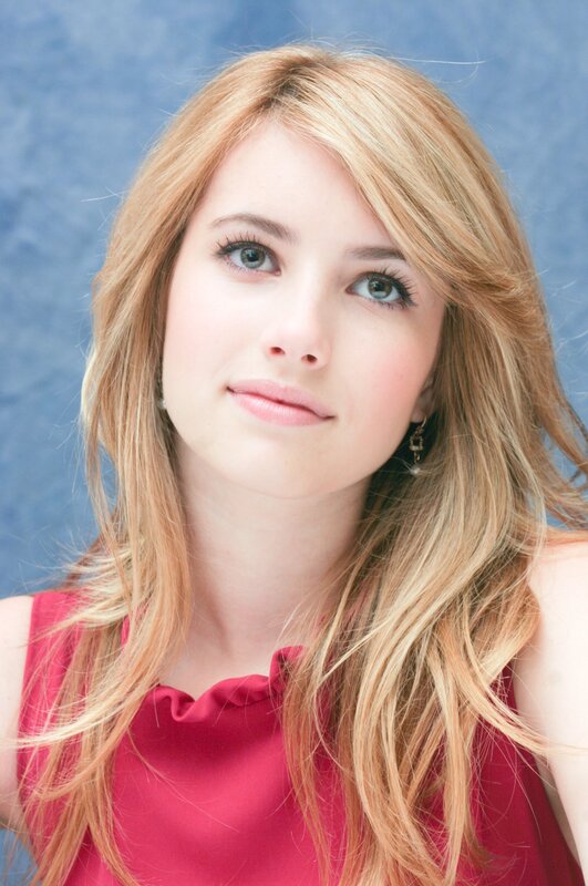 woman with blonde hair in red top