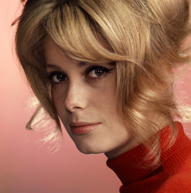 Woman with blonde hair in red turtleneck