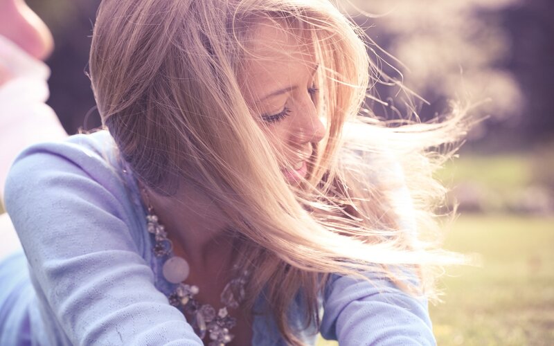 woman with blonde hair in sunlight