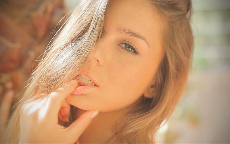woman with blonde hair in sunlight