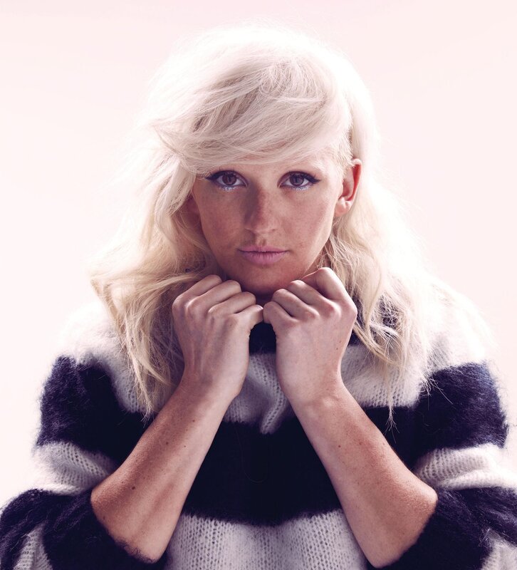 woman with blonde hair in sweater