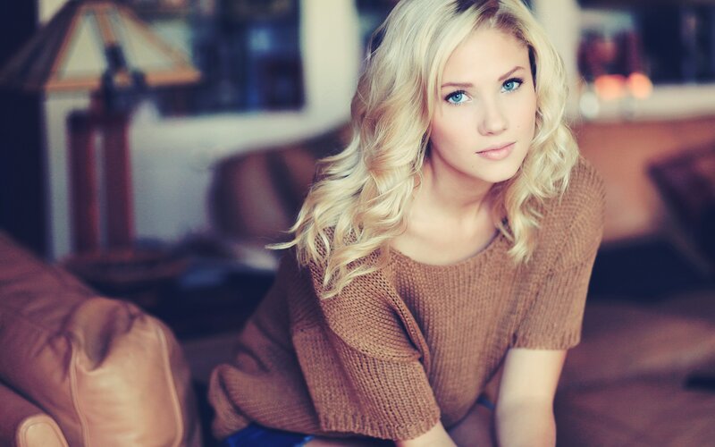 woman with blonde hair in sweater