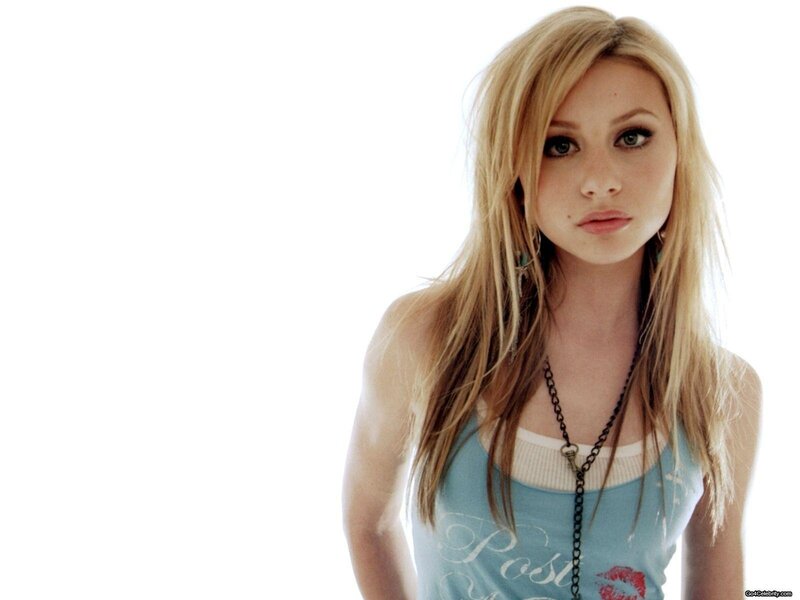 woman with blonde hair in tank top