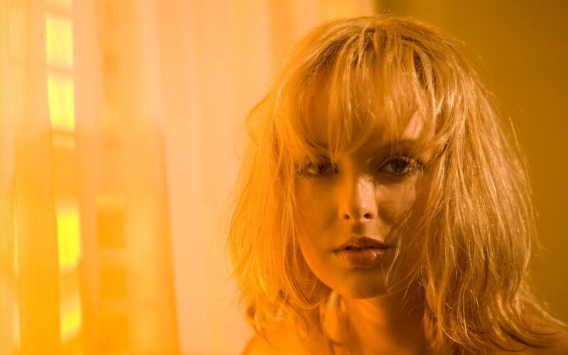 woman with blonde hair in warm light