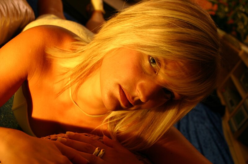 woman with blonde hair in warm light