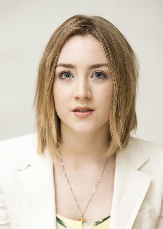 woman with blonde hair in white blazer
