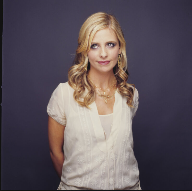 woman with blonde hair in white blouse