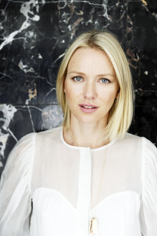 woman with blonde hair in white blouse