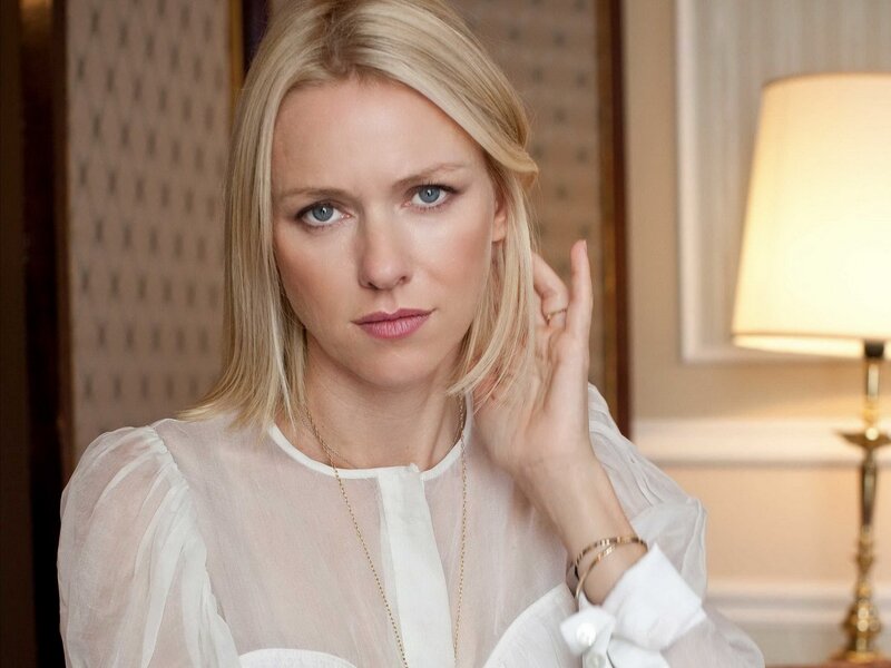 woman with blonde hair in white blouse