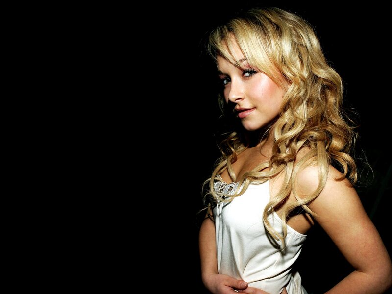 woman with blonde hair in white top