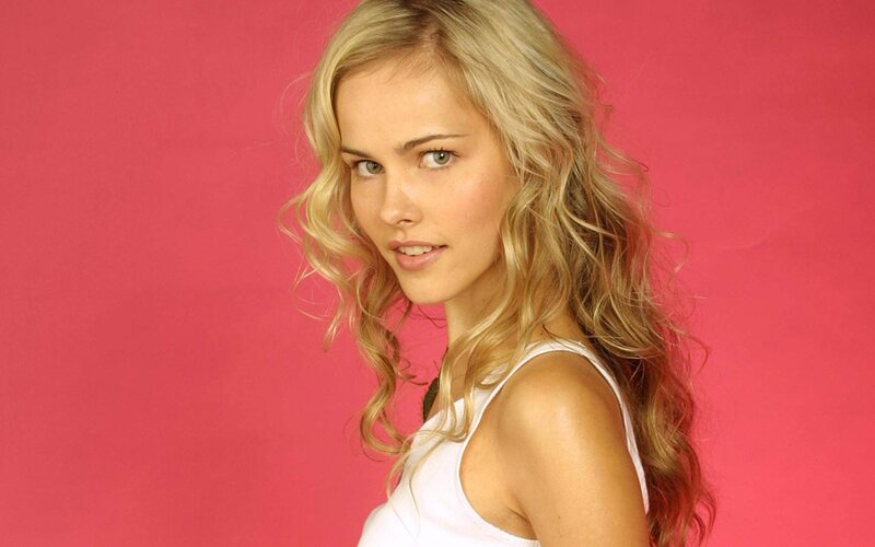 woman with blonde hair in white top