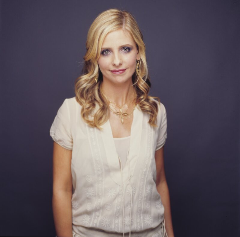 woman with blonde hair in white top