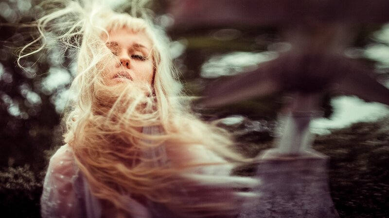 woman with blonde hair in wind