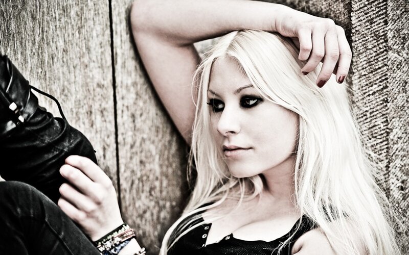 woman with blonde hair leaning