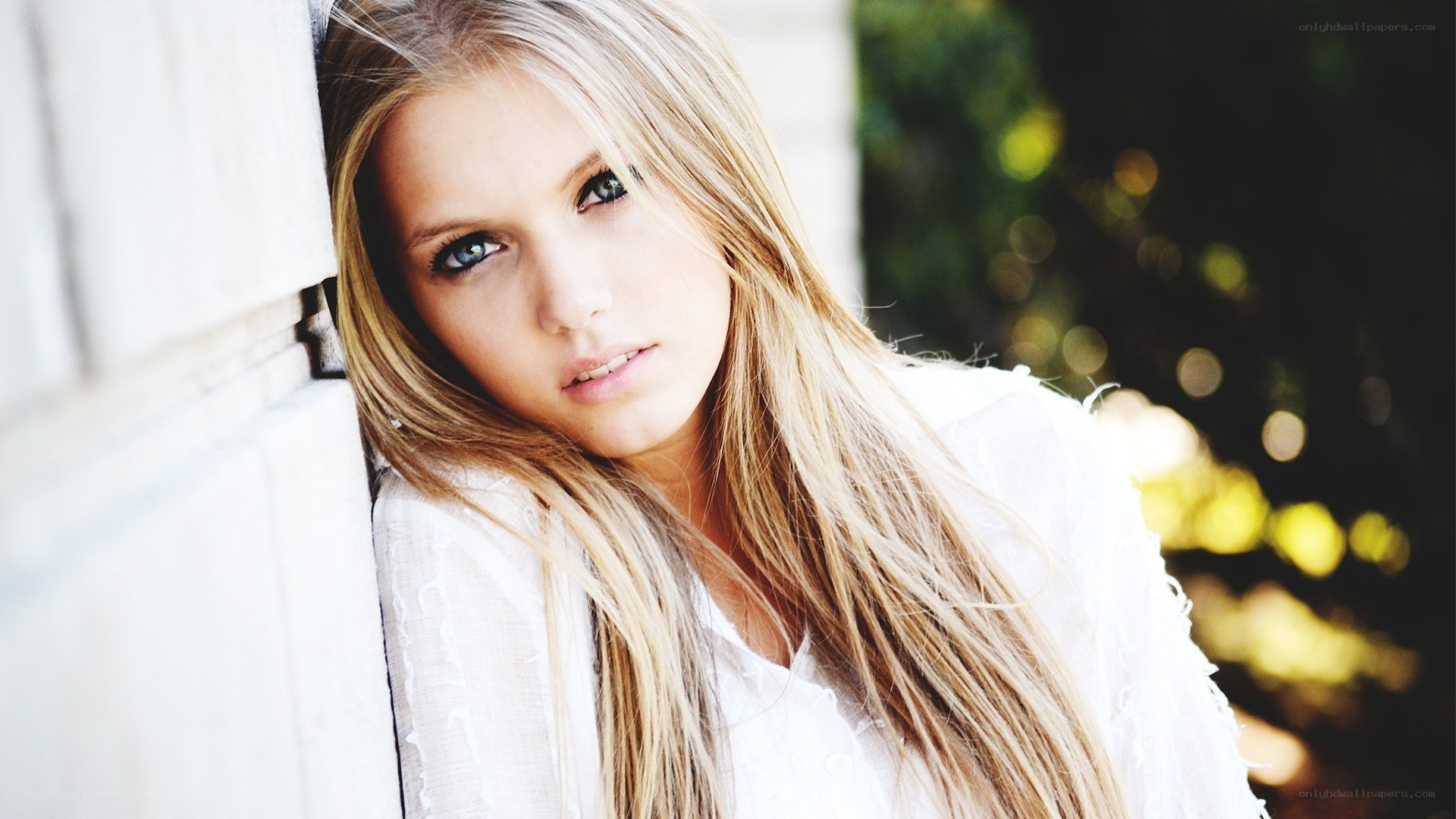 woman with blonde hair leaning