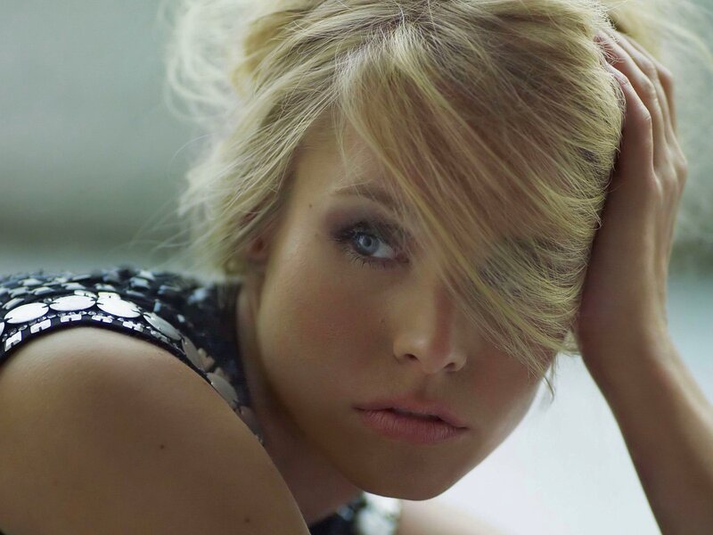 woman with blonde hair looking at camera