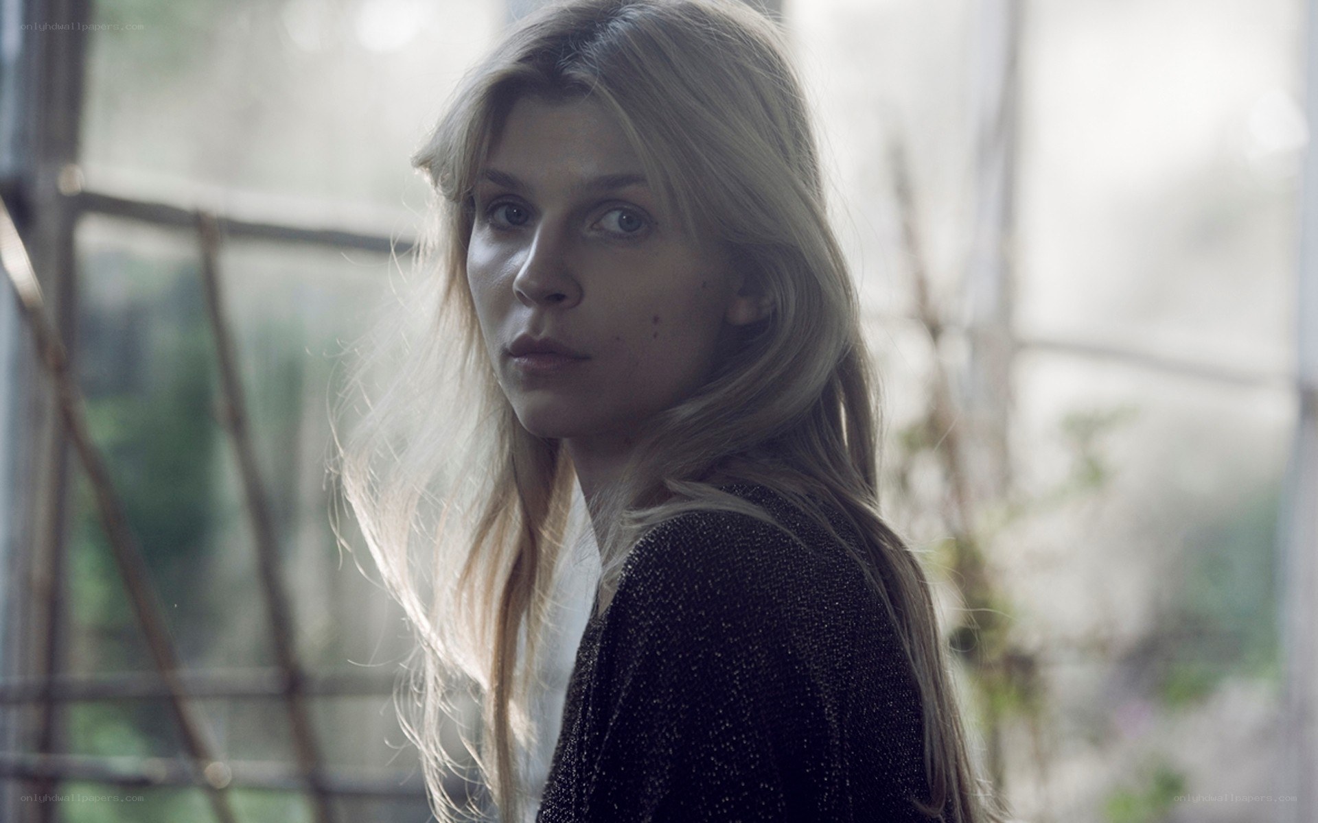 woman with blonde hair looking at camera