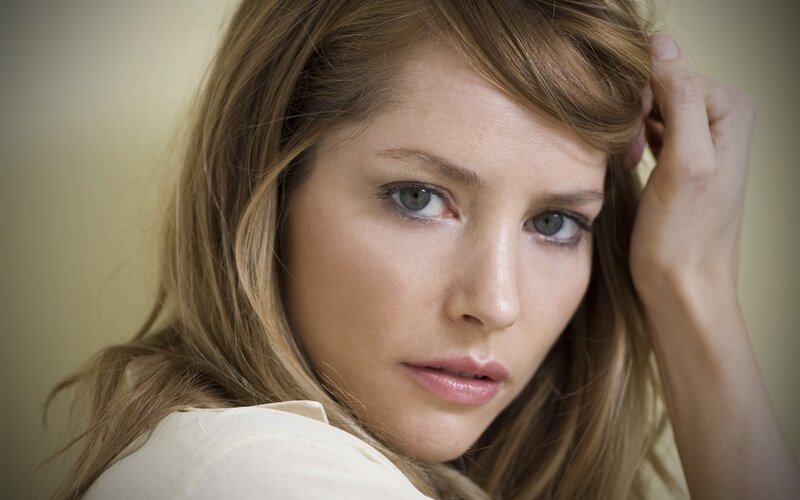 woman with blonde hair looking at camera