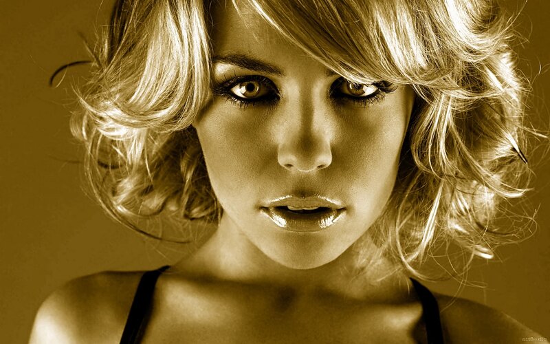 woman with blonde hair looking at camera