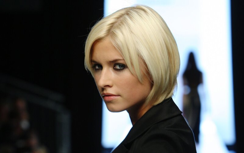 woman with blonde hair looking at camera