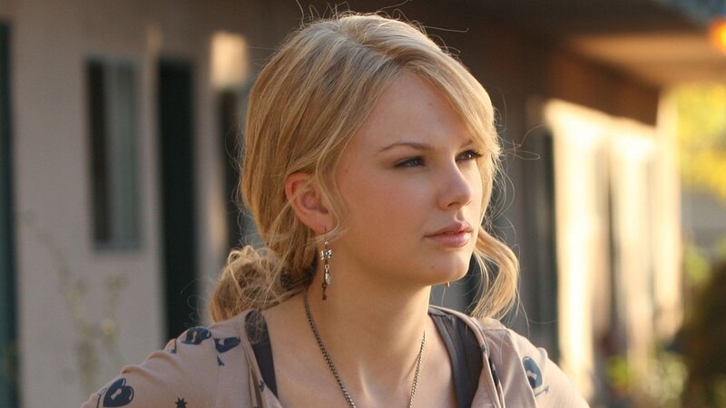 woman with blonde hair looking away