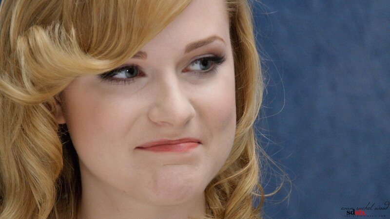 woman with blonde hair looking away