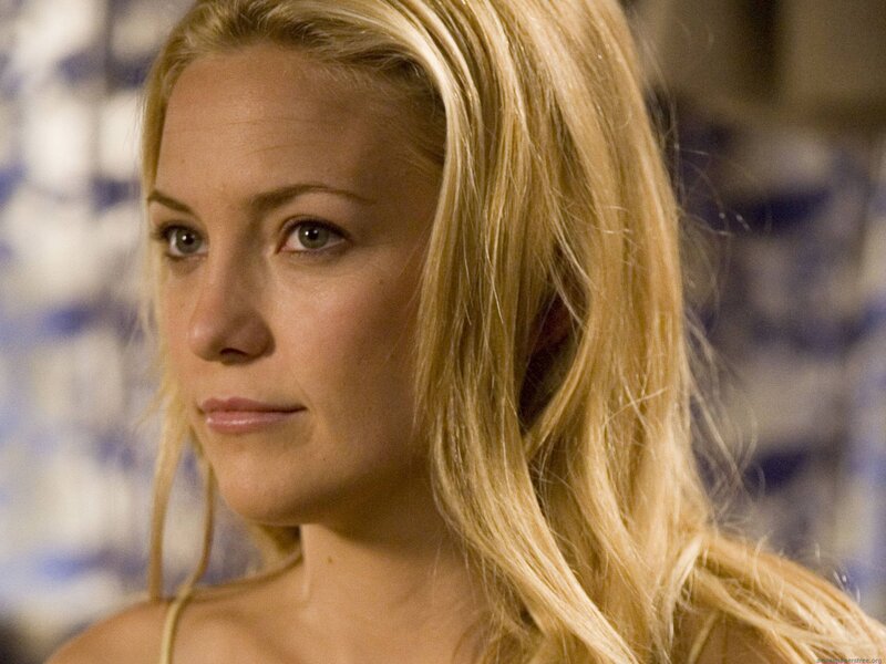 woman with blonde hair looking away