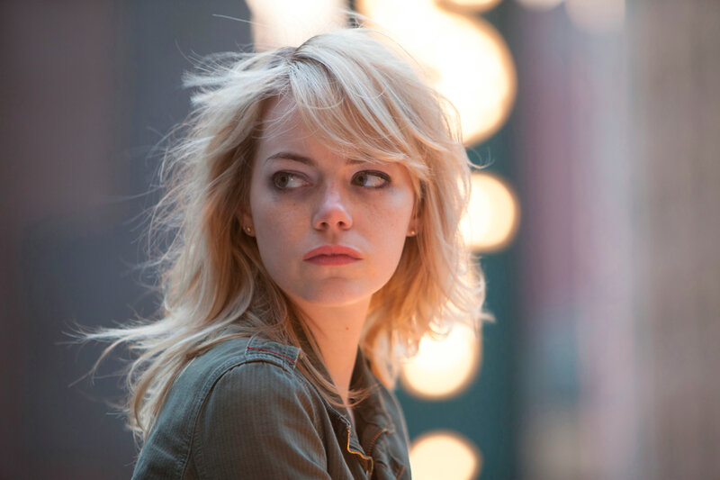 woman with blonde hair looking away