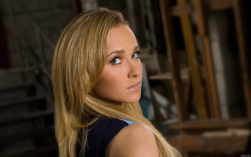 woman with blonde hair looking back