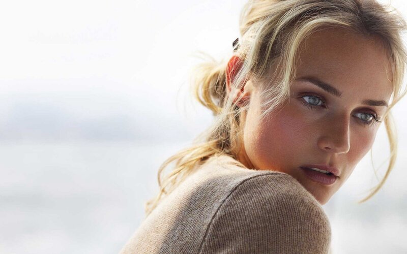 woman with blonde hair looking back