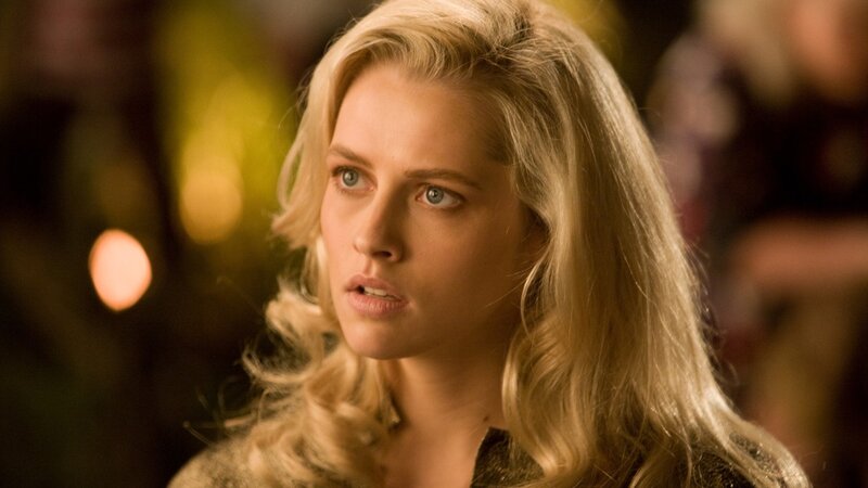 woman with blonde hair looking concerned