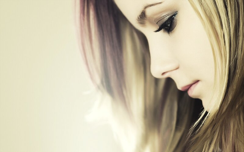 woman with blonde hair looking down