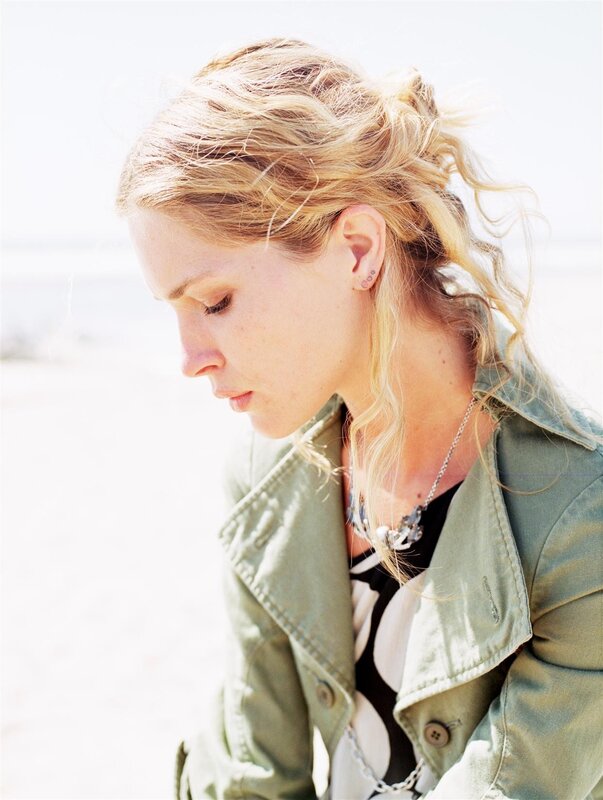 woman with blonde hair looking down