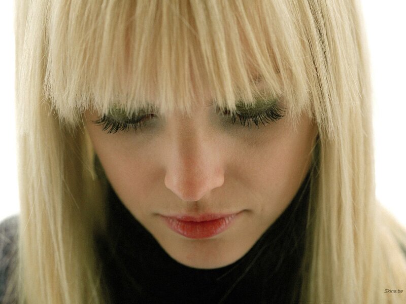 woman with blonde hair looking down