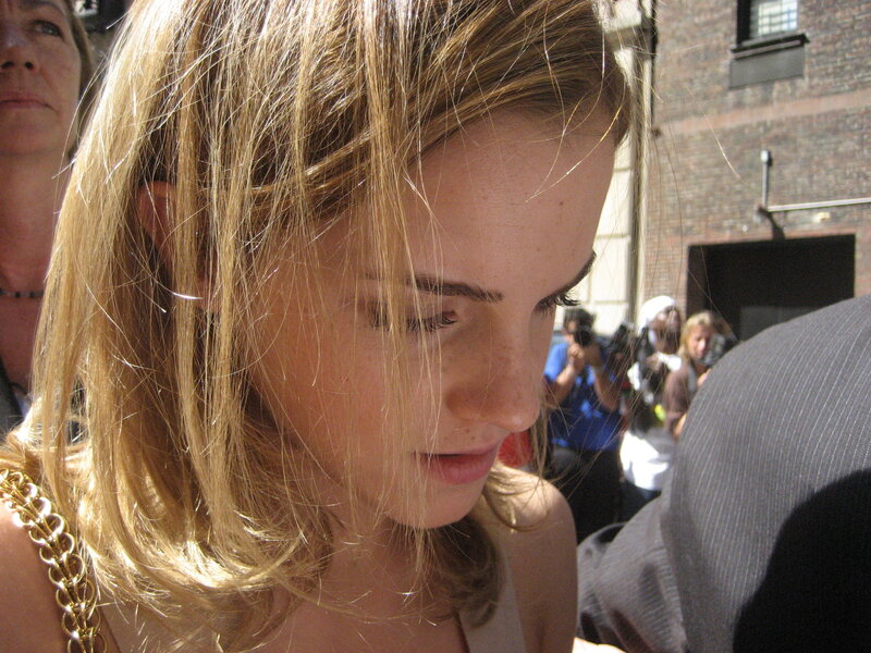 woman with blonde hair looking down