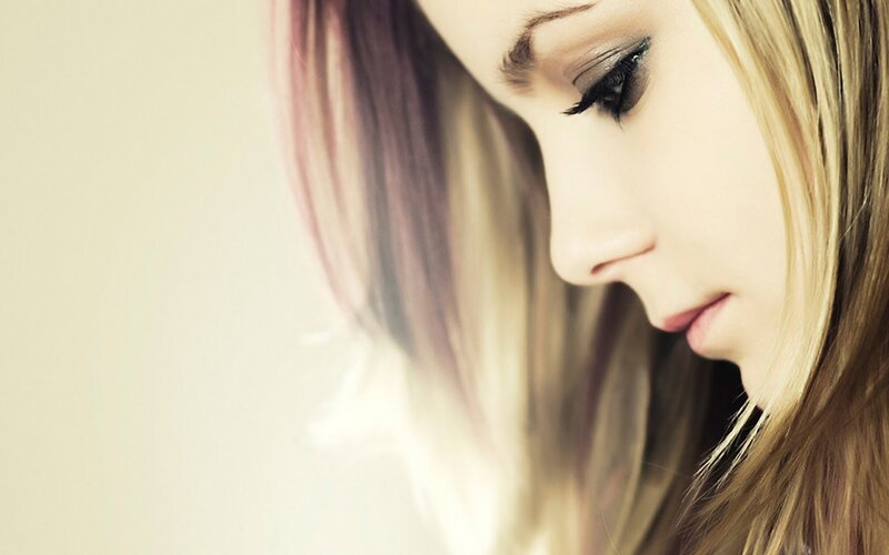 woman with blonde hair looking down