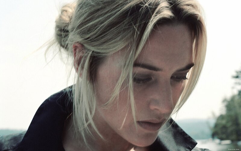 woman with blonde hair looking down