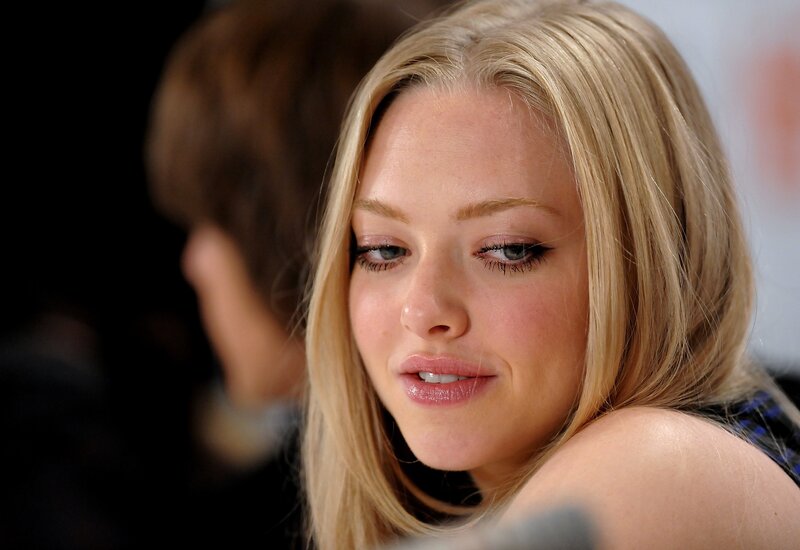 woman with blonde hair looking down