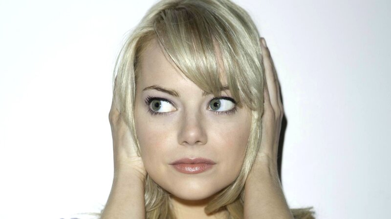 woman with blonde hair looking sideways