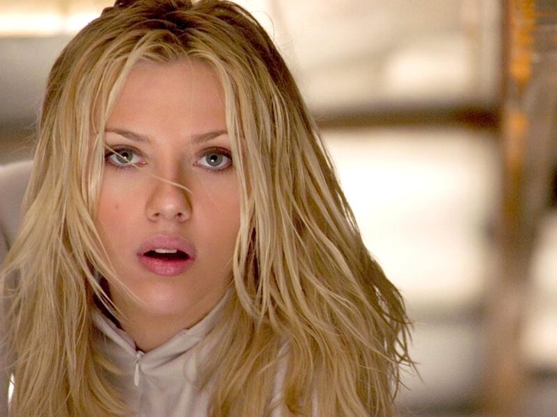 woman with blonde hair looking surprised