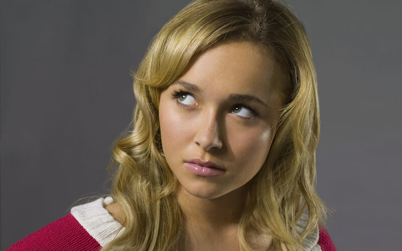 woman with blonde hair looking up
