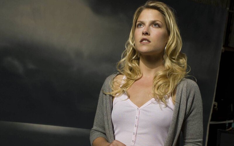 woman with blonde hair looking up