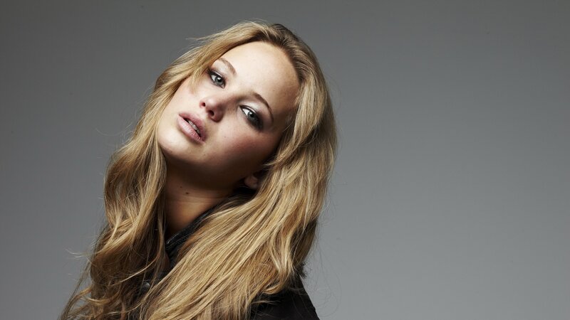 woman with blonde hair looking up