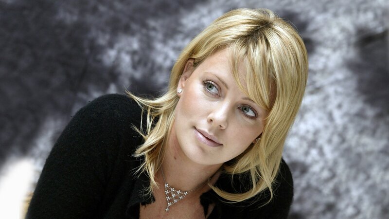 woman with blonde hair looking up