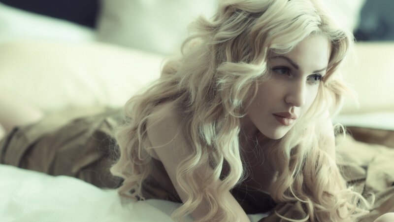 woman with blonde hair lying down